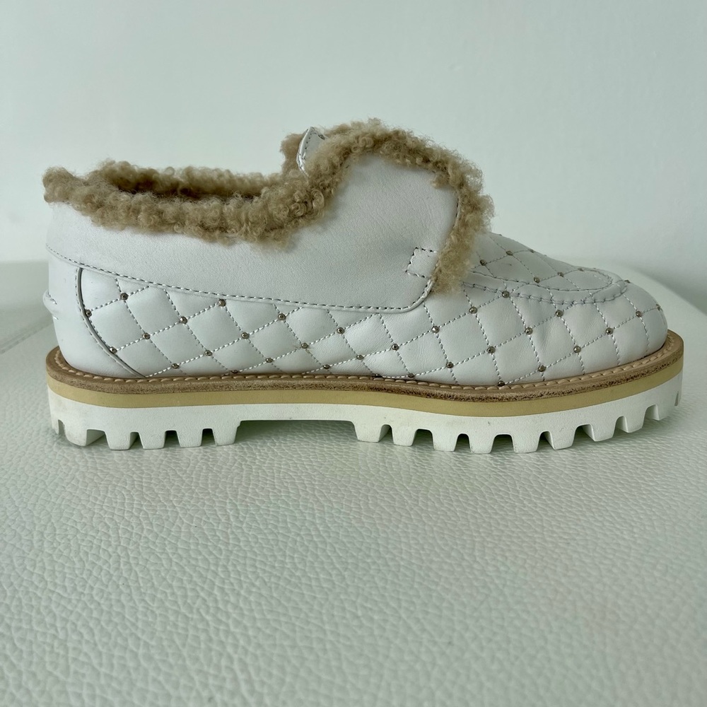 Hand made in Italy, white quilted leather upper with gold embellishments.